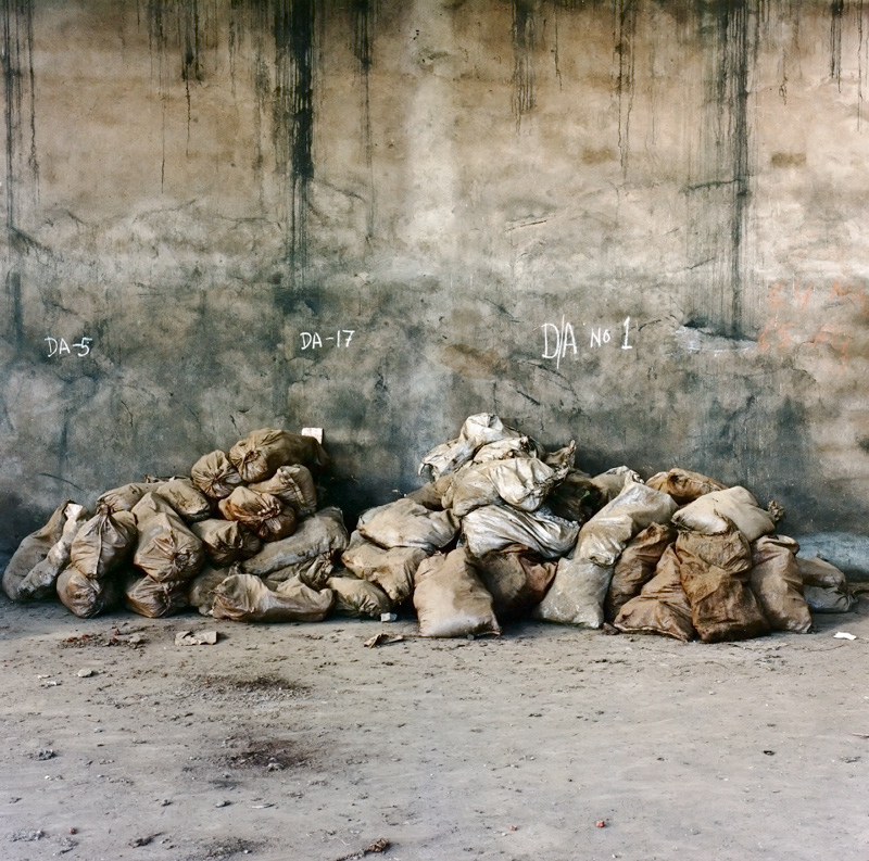 Sacks of Lindane (hexachlorocyclohexane) lie in an insecure go-down.The chemical can cause cancers and multiple congenital abnormalities. Photo by Andy Moxom