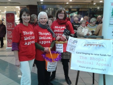  Agnes Riley (centre) helping with the collection. 