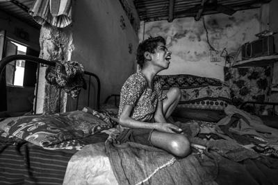 BHOPAL, INDIA: Huma, 14 years old, at home in the J.P. Nagar neighborhood. Huma was born to parents contaminated by a carcinogenic and mutagenic water supply. This year marks the 31st anniversary of the 1984 Union Carbide gas tragedy that killed up to 10,000 of the citizens of Bhopal within 72 hours and has gone on to claim in total 25,000 lives to date. The original site of the toxic pesticide plant was never cleaned up and remains, as referred to by Greenpeace as one of the world's 'toxic hotspots'. Thousands of families, for decades, been using water contaminated with toxic chemicals as their primary supply leading to serious illnesses, including cancers, and a spate of birth defects in their children.